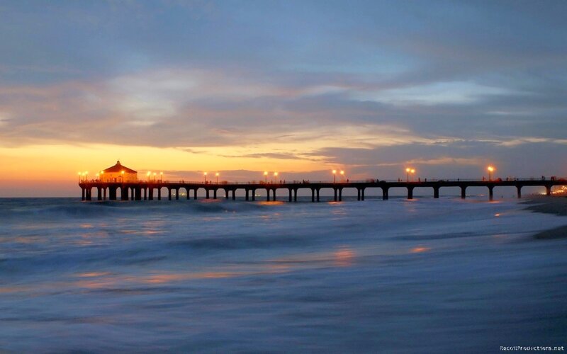 Pier at sunset with ocean waves