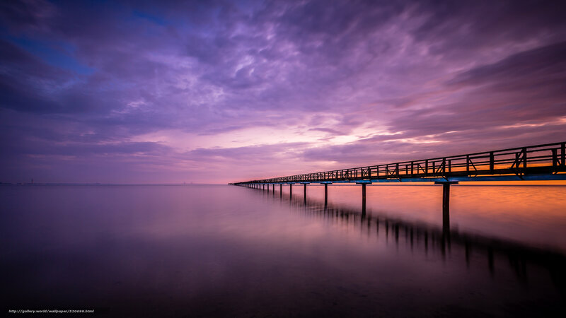 Pier at sunset with purple sky