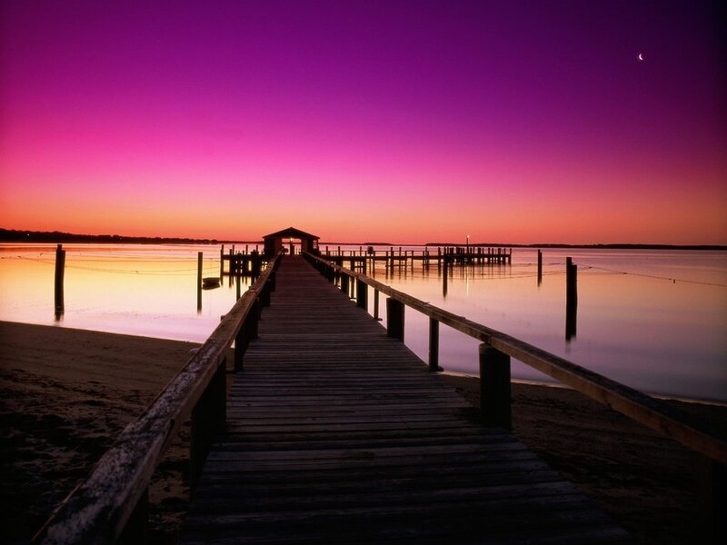 Pier at sunset with purple sky