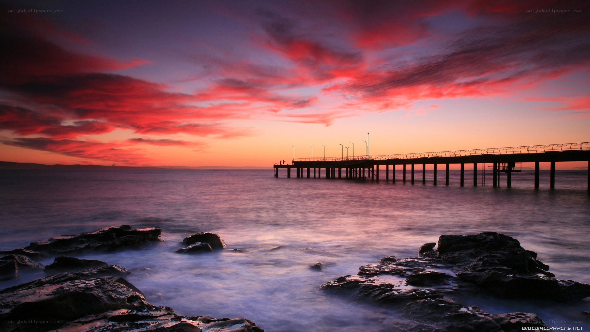 Pier at sunset with red sky