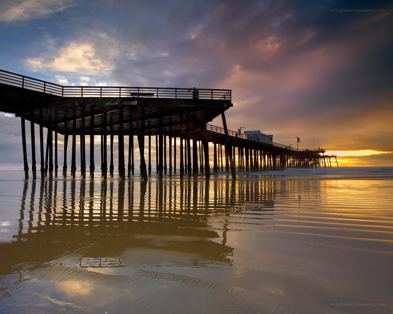 Pier at sunset with reflection