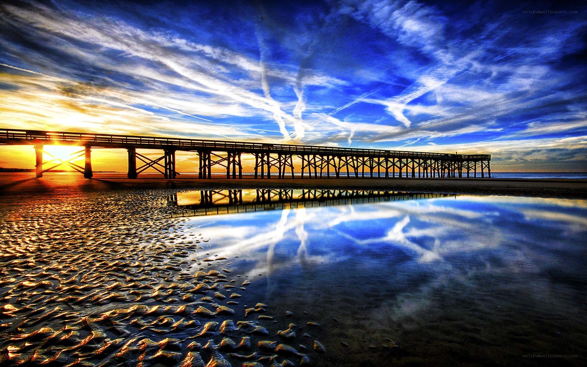 Pier at sunset with reflection