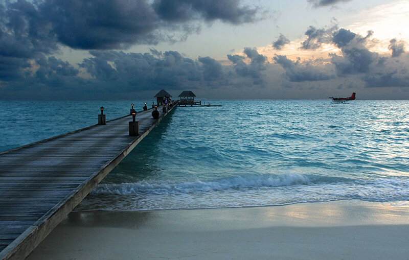 Pier at sunset with seaplane