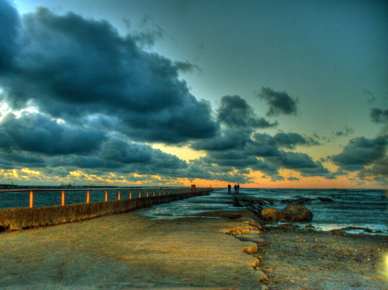 Pier at sunset with storm clouds