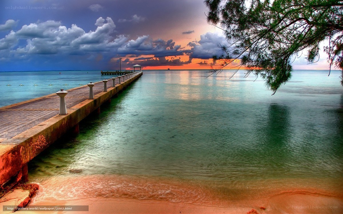 Pier at sunset with stormy sky