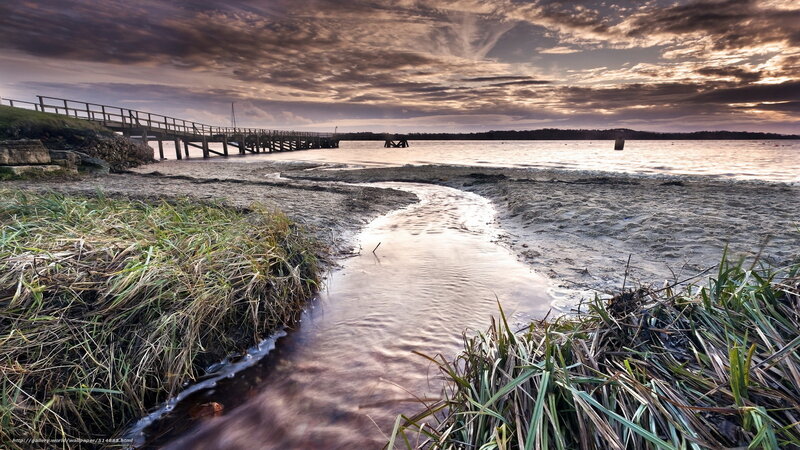 Pier at sunset with stream