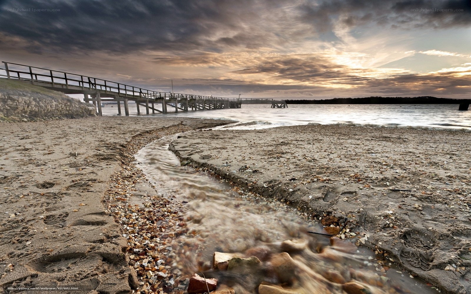 Pier at sunset with stream