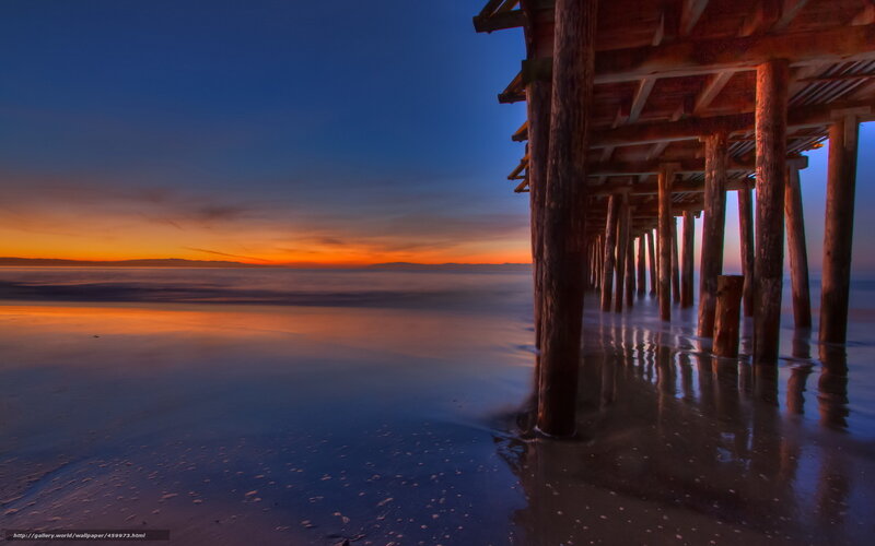 Pier at sunset with vibrant sky