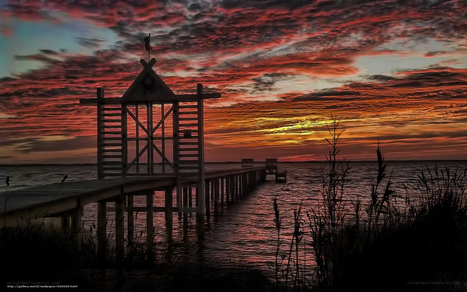 Pier at sunset with vibrant sky