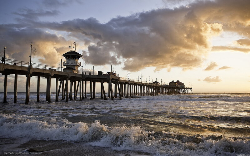 Pier at sunset with waves