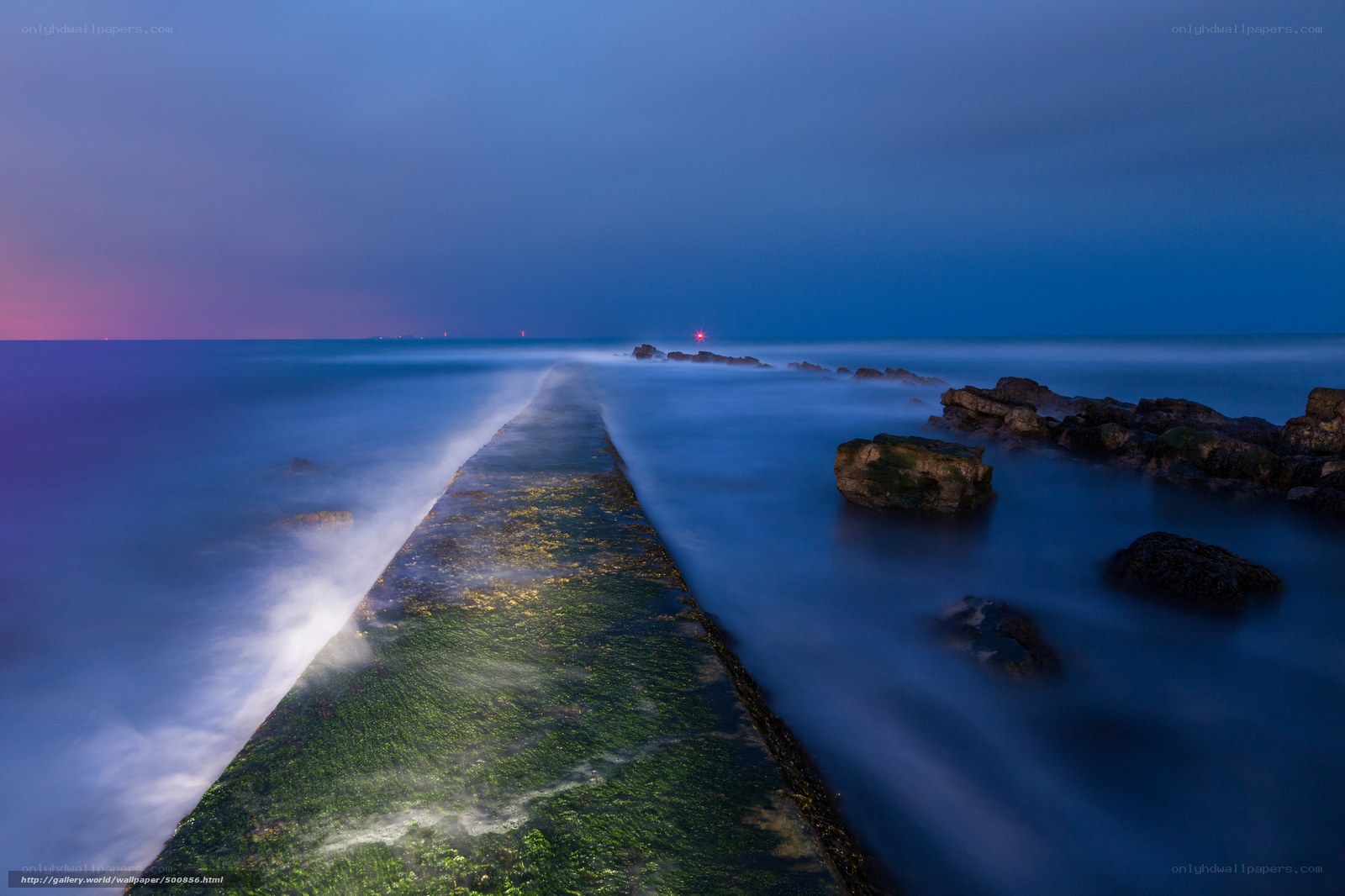Pier at twilight with glowing lights