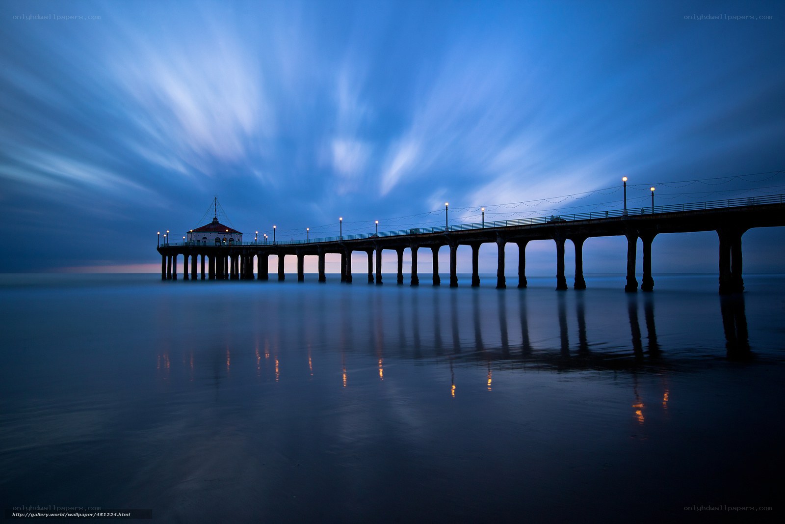 Pier at twilight with light trails