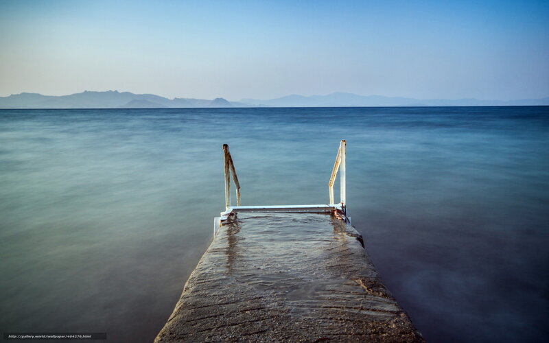 Pier extending into calm sea