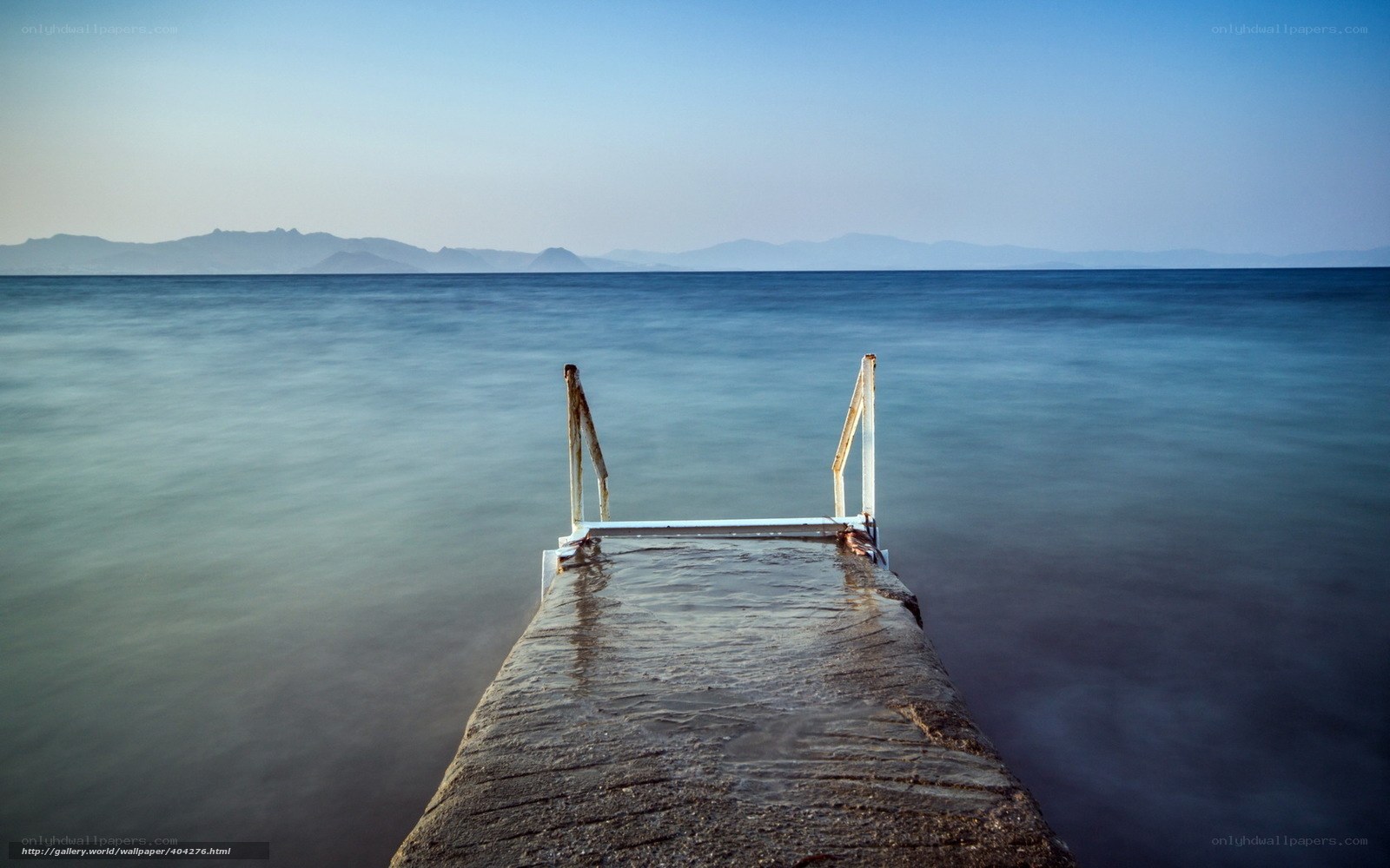 Pier extending into calm sea