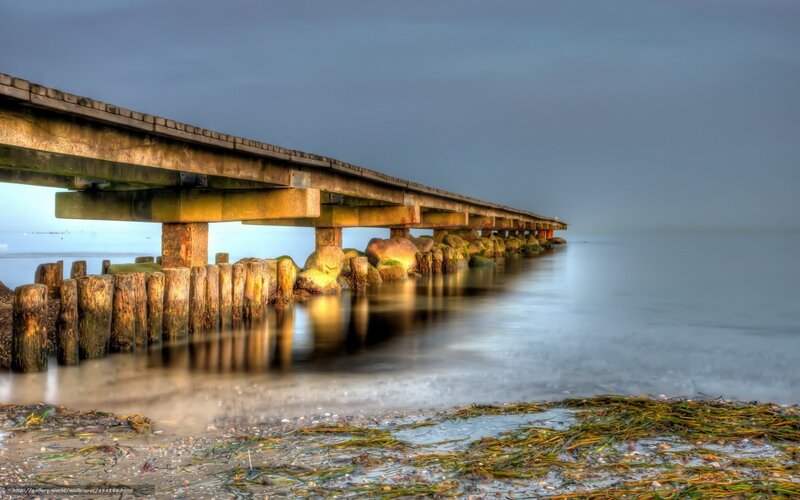 Pier extending into calm sea