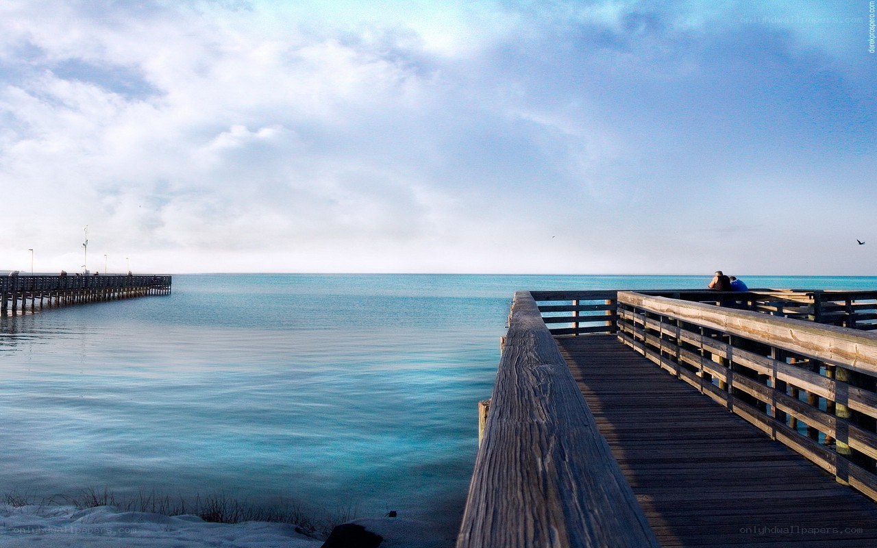 Pier extending into calm sea