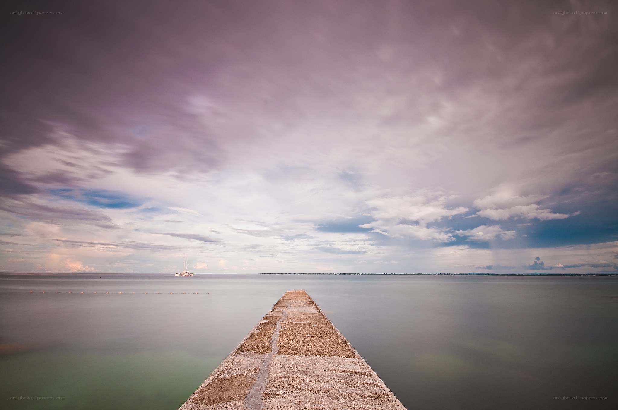 Pier extending into calm sea