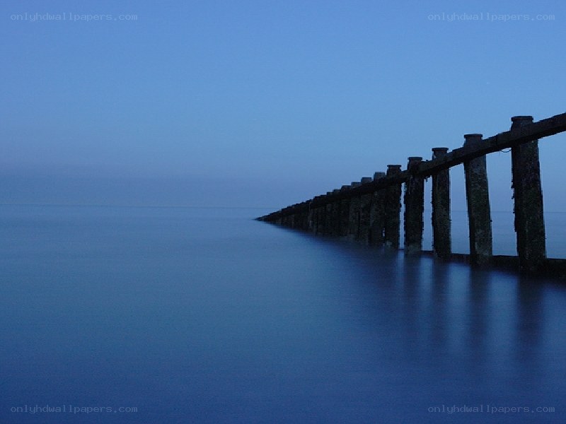 Pier extending into calm sea