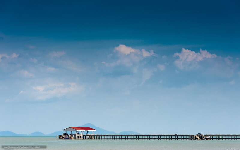 Pier extending into calm sea