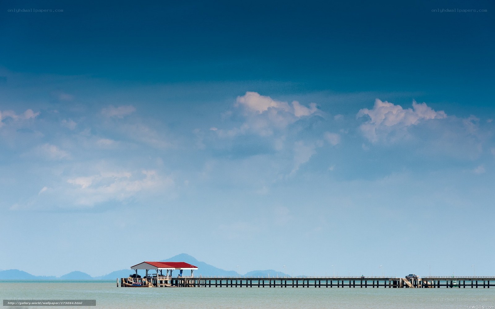Pier extending into calm sea