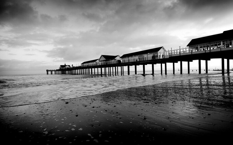 Pier Extending into Ocean — Black