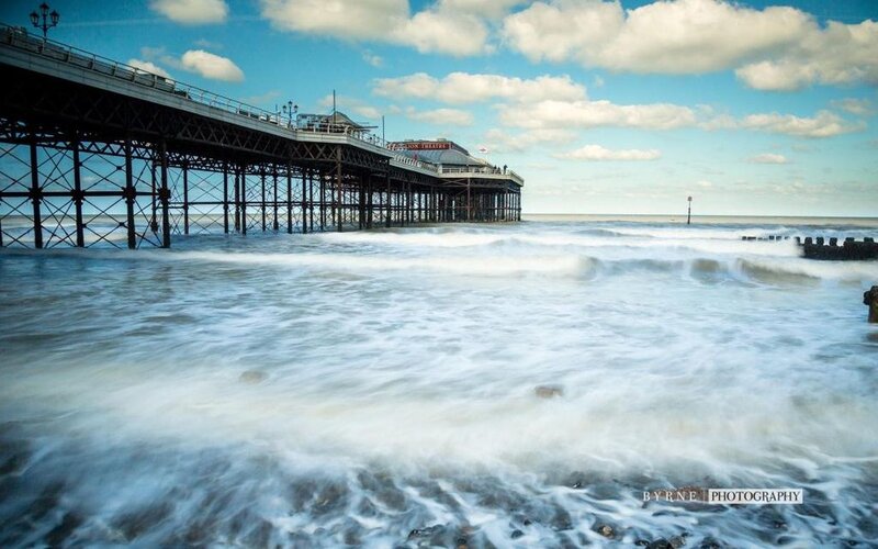 Pier Extending into Ocean — Blue, Dramatic, Afternoon