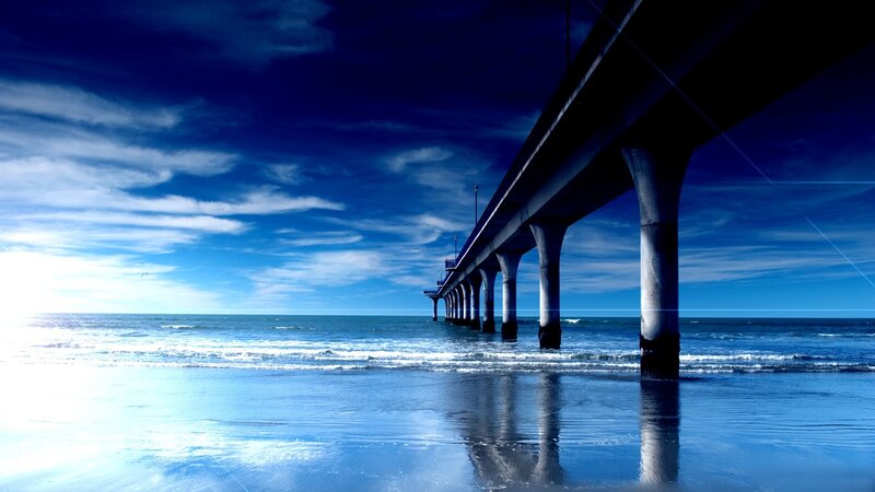 Pier Extending into Ocean — Blue, Serene, Afternoon