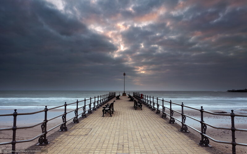 Pier Extending into Ocean — Gray, Dramatic