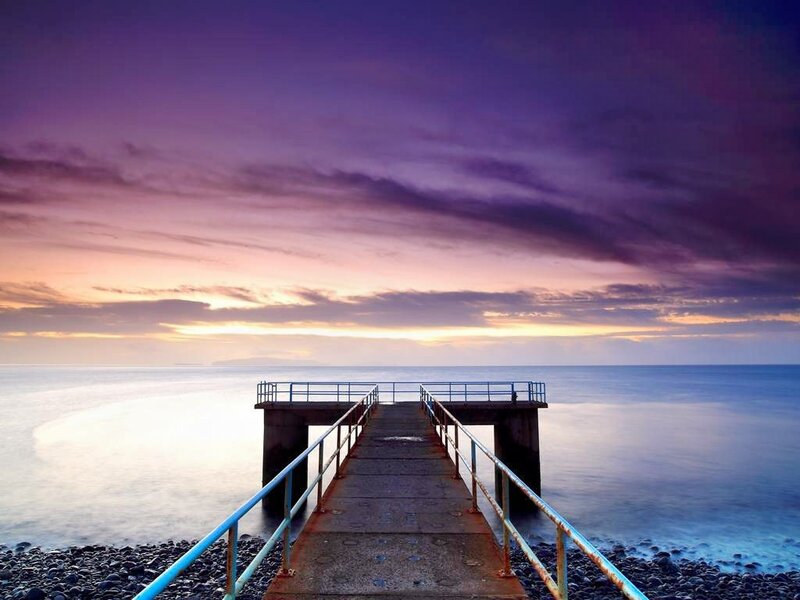Pier Extending into Ocean — Purple, Serene