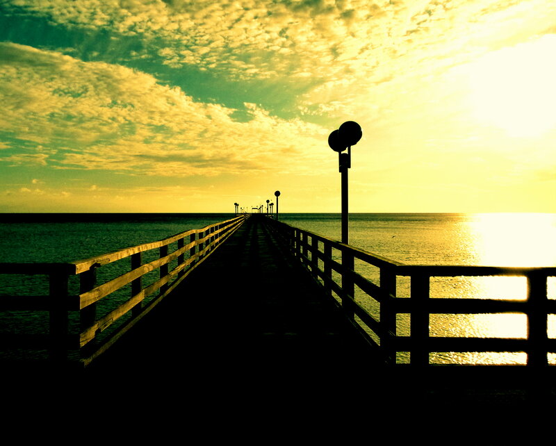 Pier Extending into Ocean — Yellow