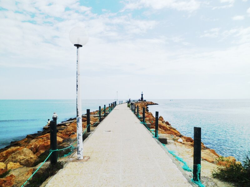 Pier Extending into Sea — Blue, Serene, Afternoon