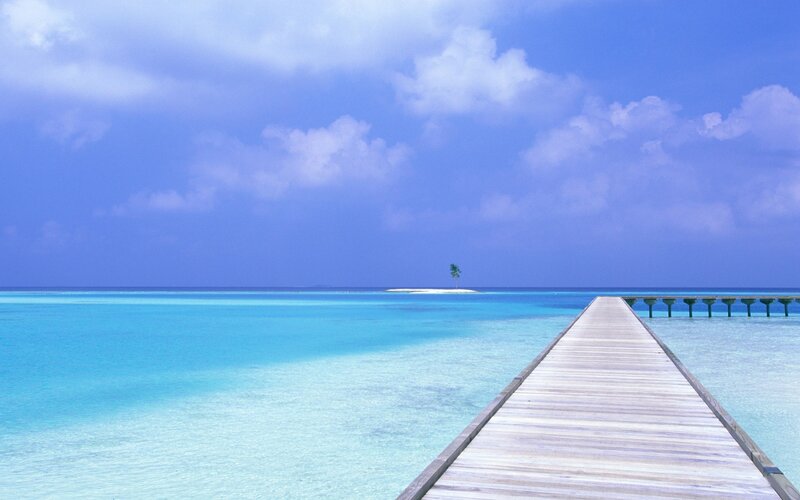 Pier leading to tropical island