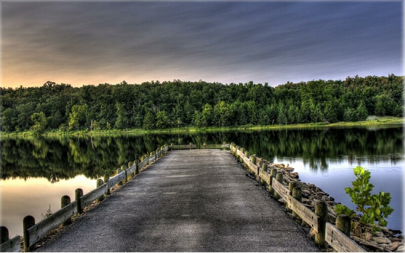 Pier on a calm lake at dusk