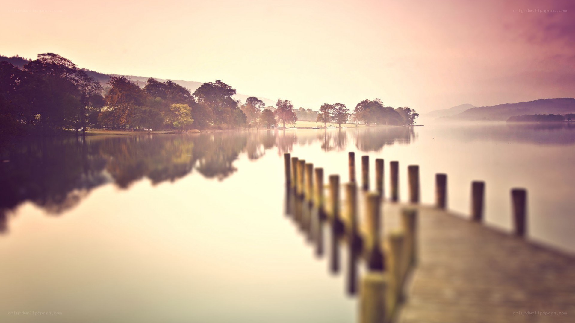 Pier on a misty lake