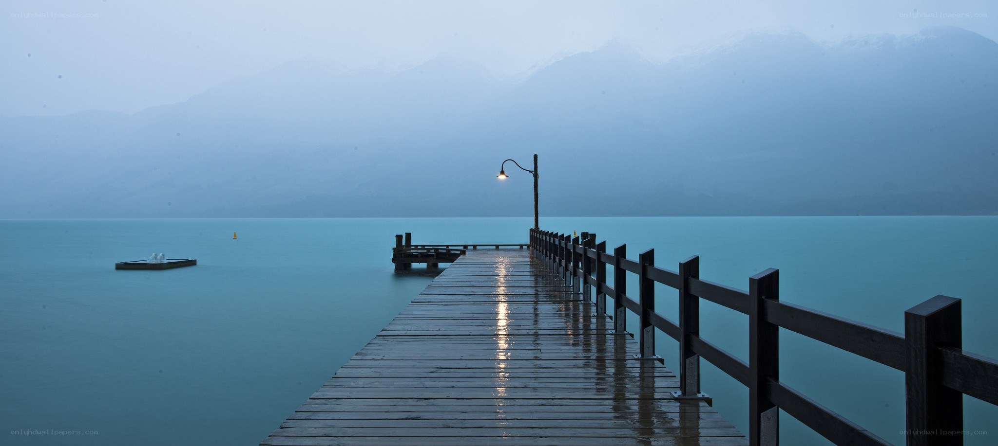 Pier on a misty lake