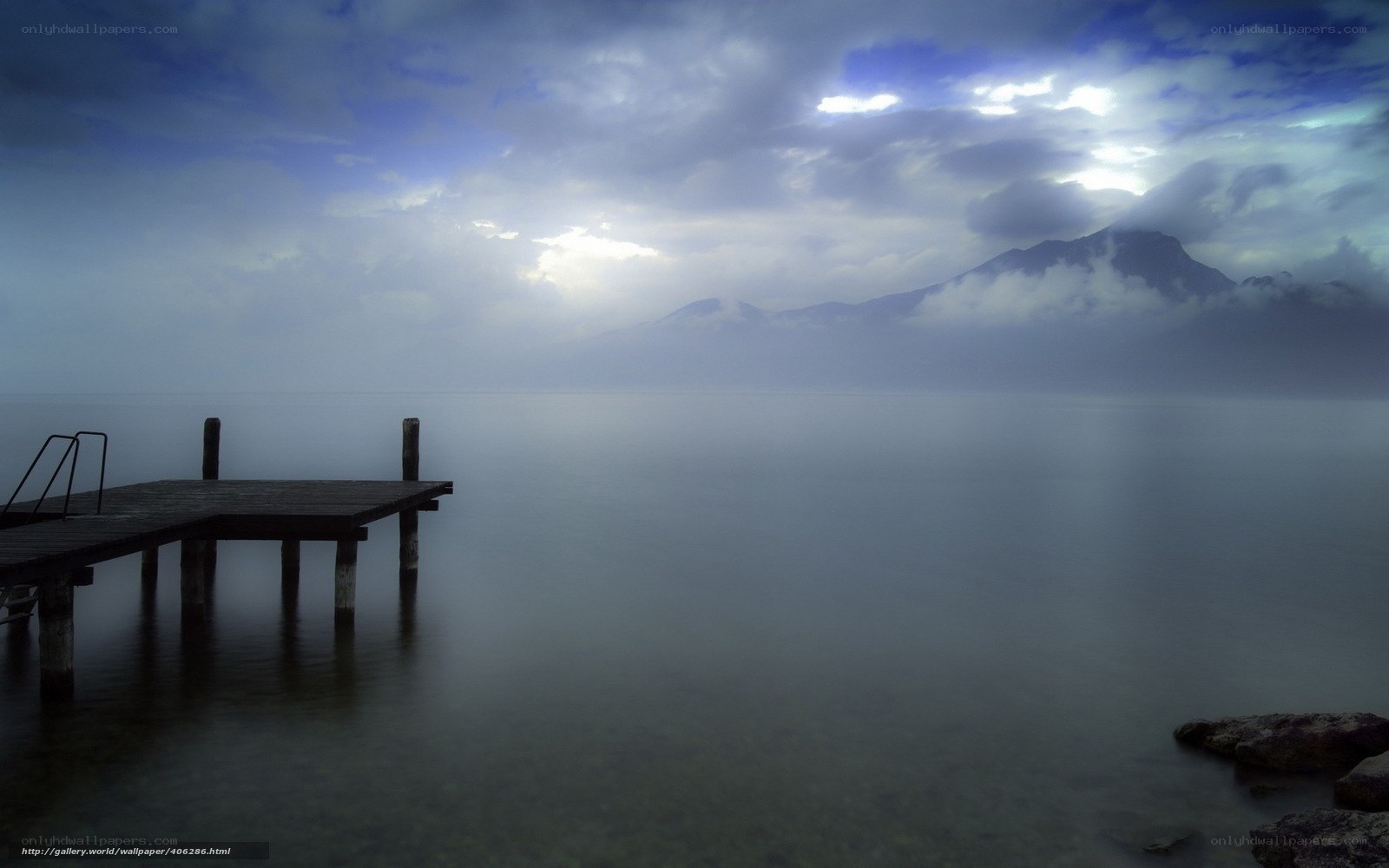 Pier on a misty lake