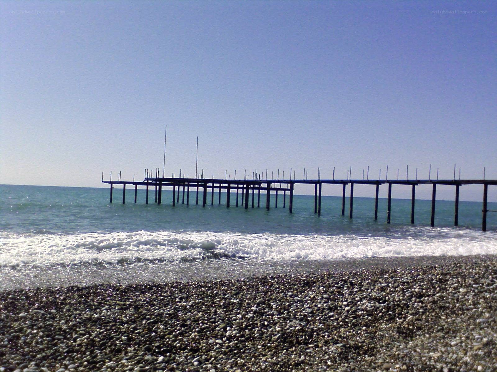 Pier on a pebble beach