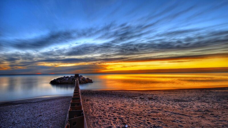 Pier on Beach at Sunset