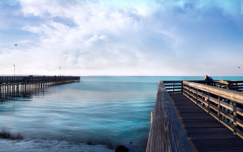 Pier over calm blue water