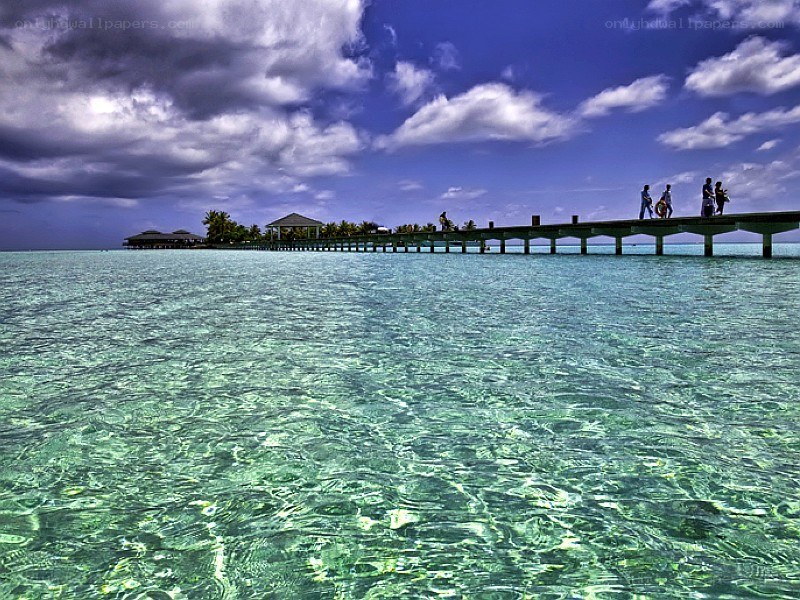 Pier over turquoise water