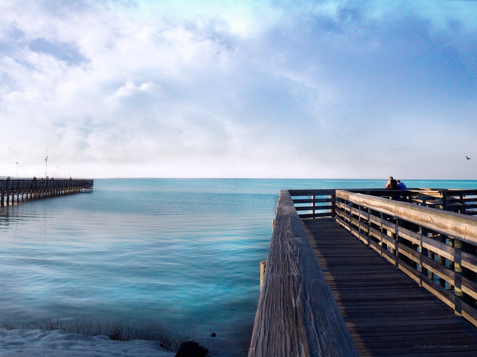 Pier over turquoise water
