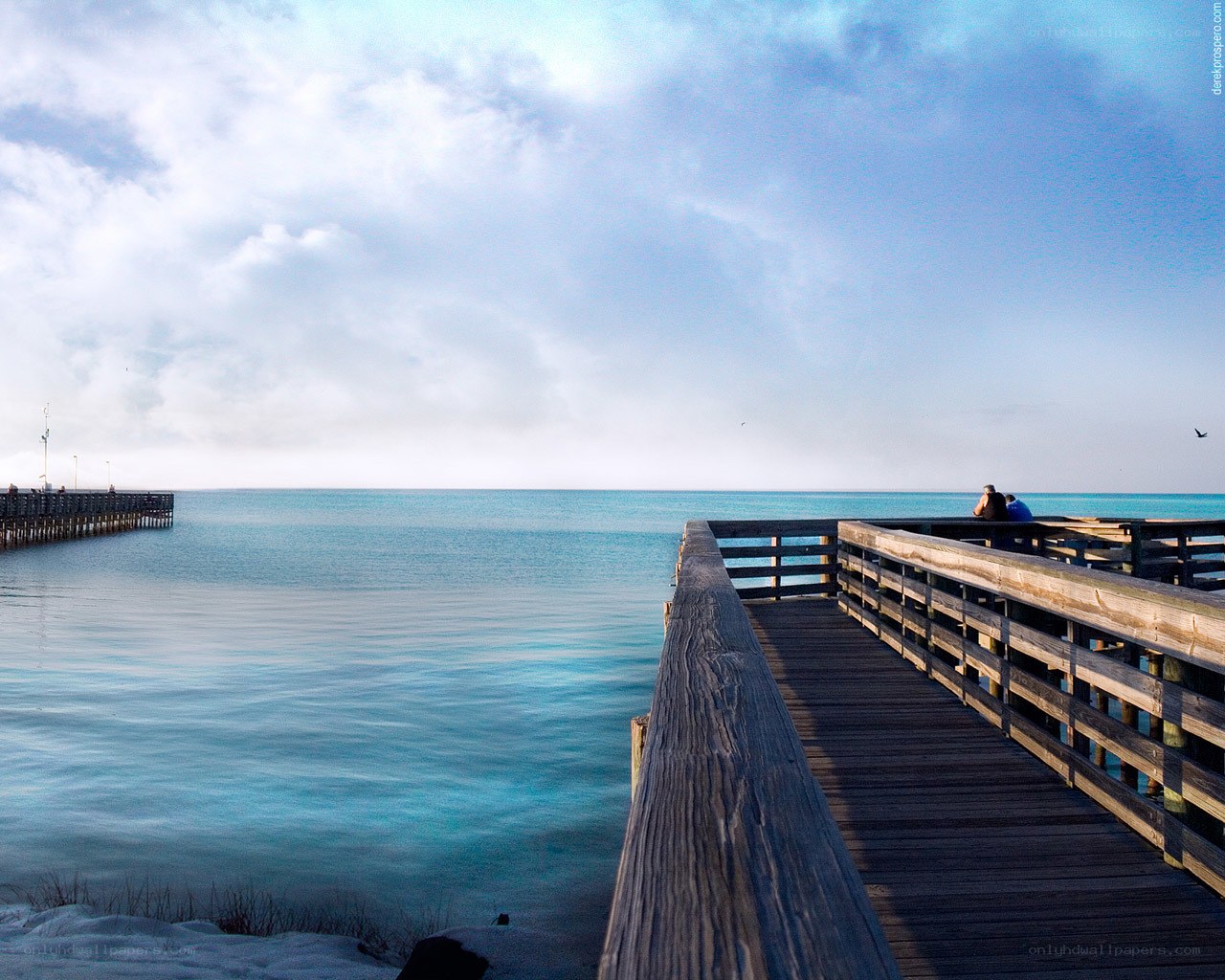 Pier overlooking calm turquoise water