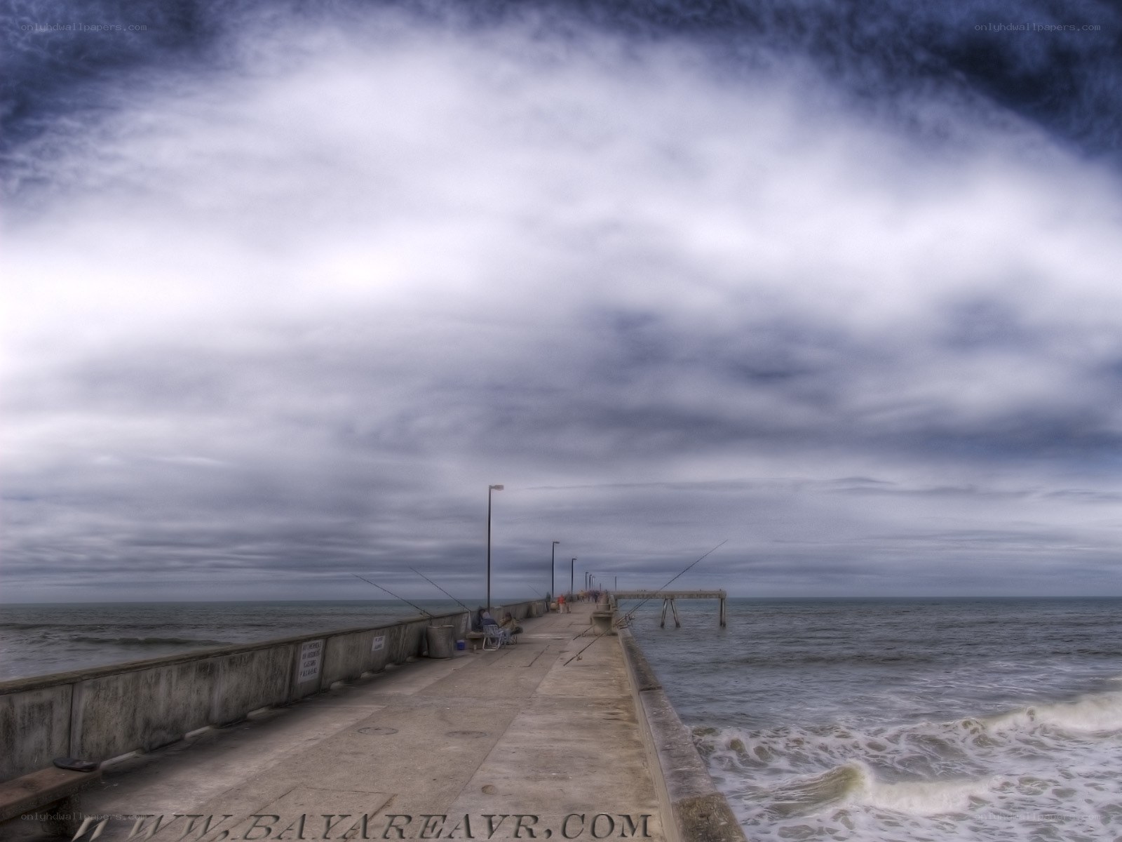 Pier under cloudy sky