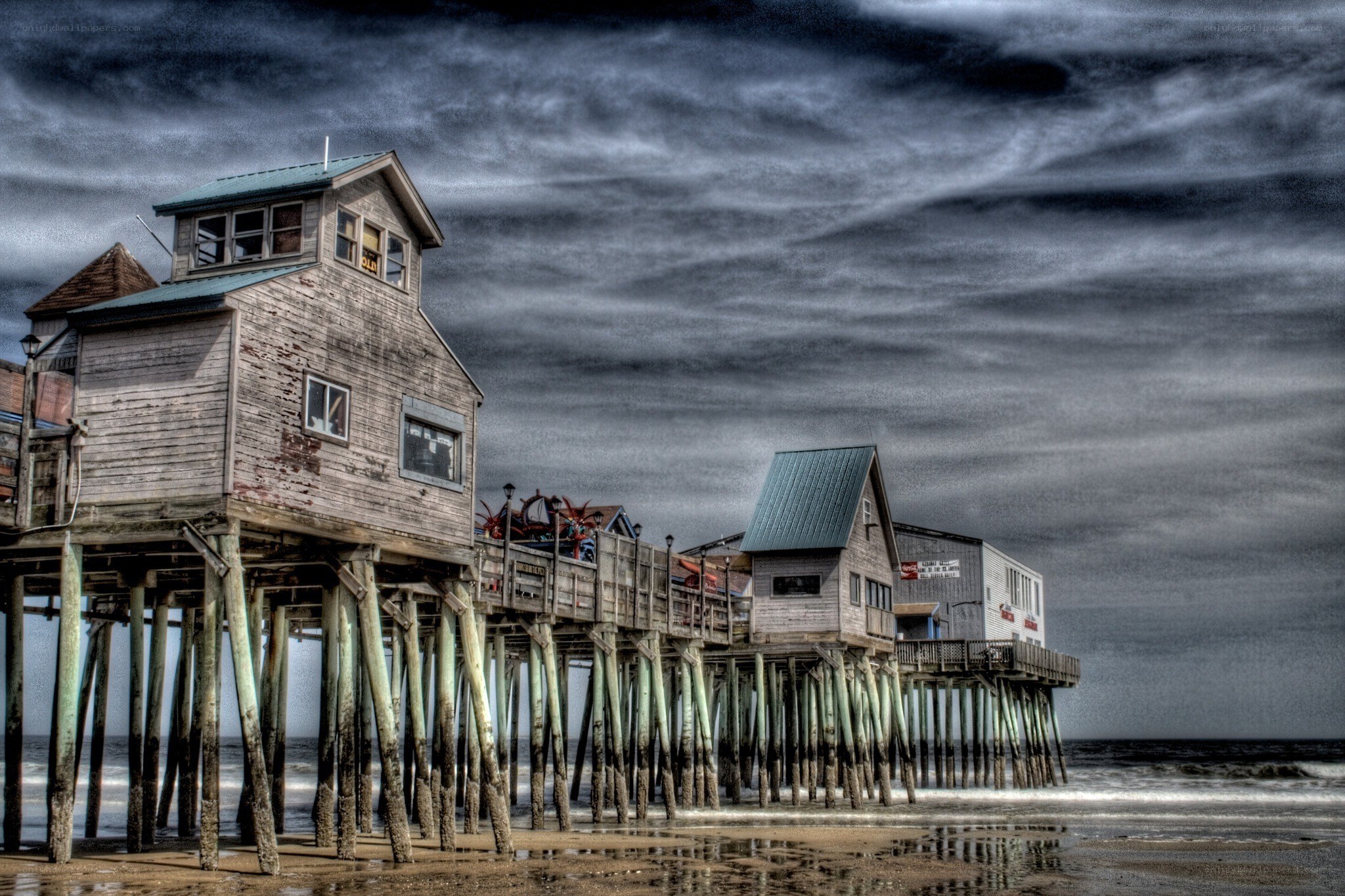 Pier under stormy sky