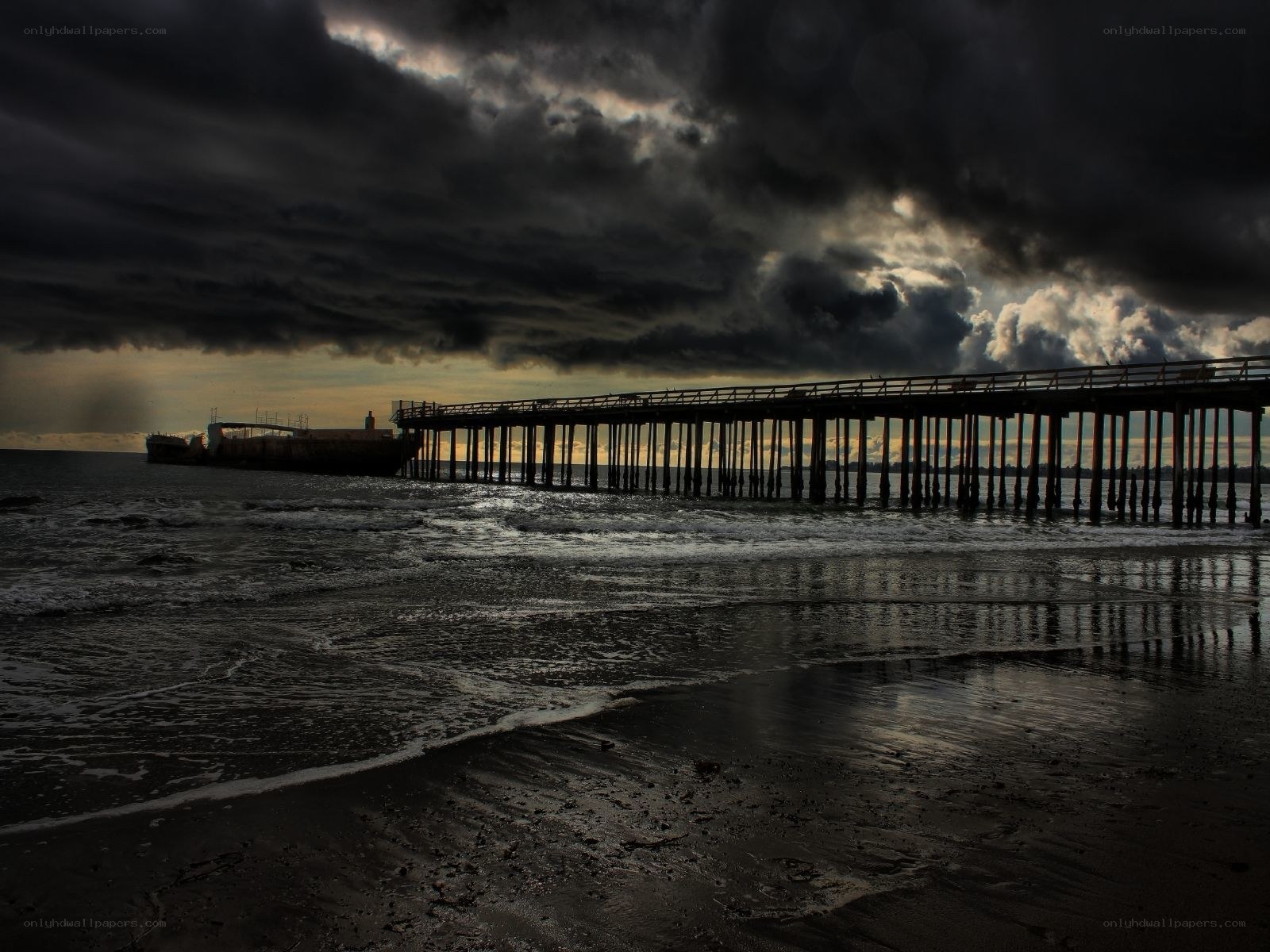 Pier under stormy sky