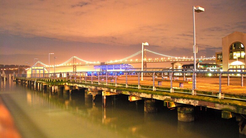 Pier with Bridge in Background — Orange