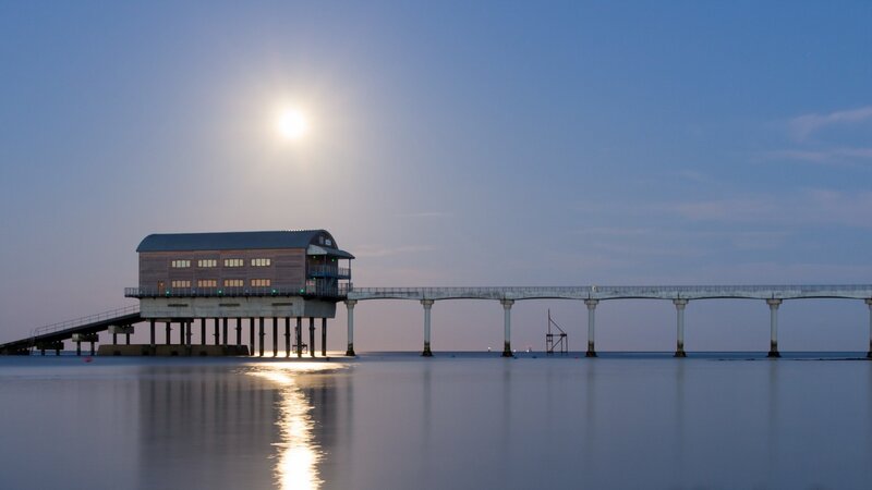 Pier with Building at Dusk
