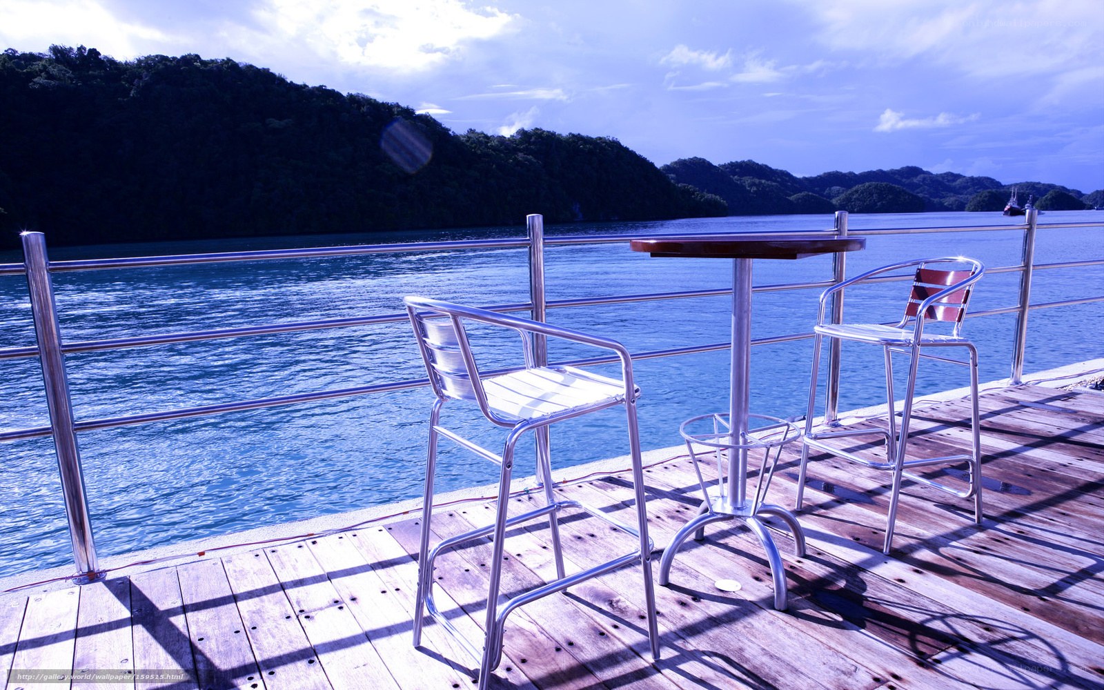 Pier with chairs overlooking the sea
