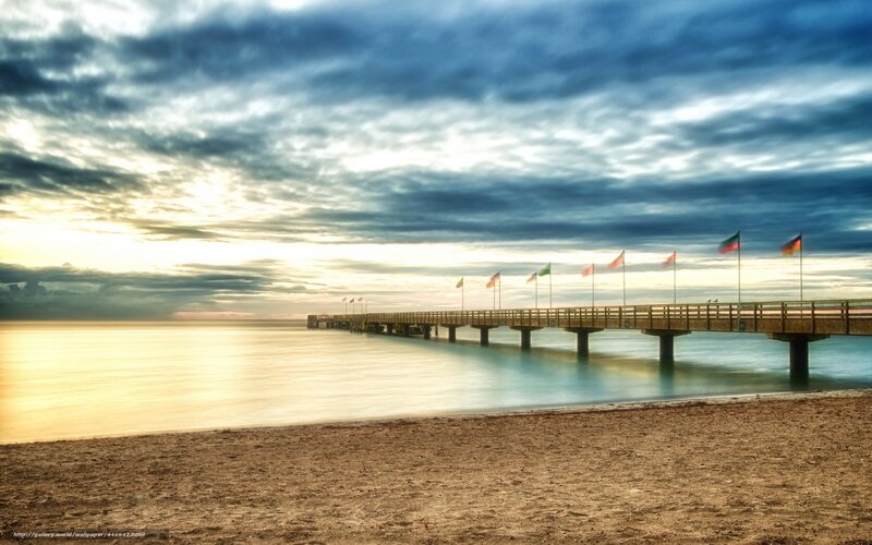 Pier with Flags at Sunset