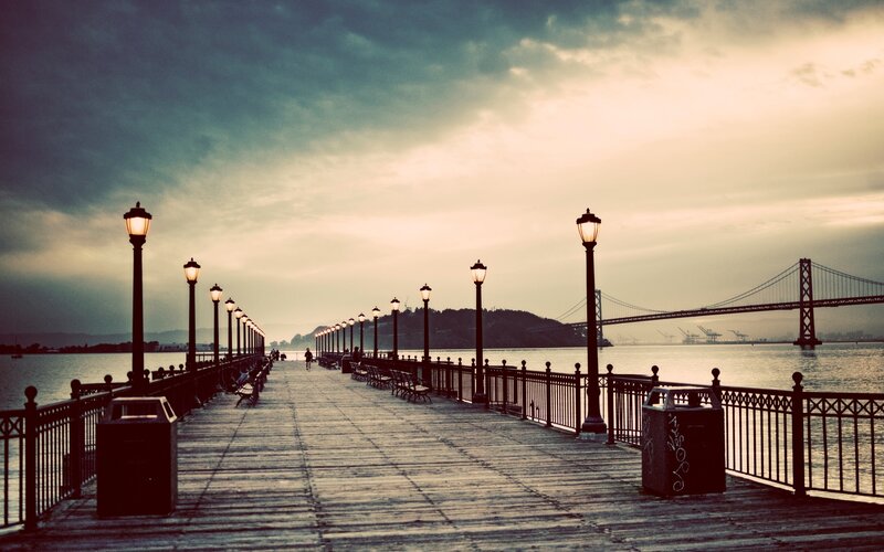 Pier with Lit Lamps